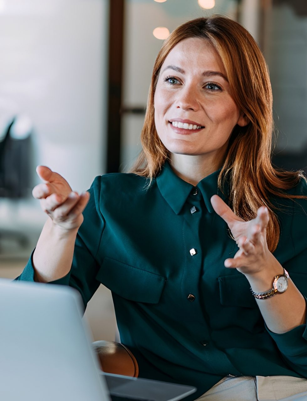 Smiling woman gesturing during a conversation.