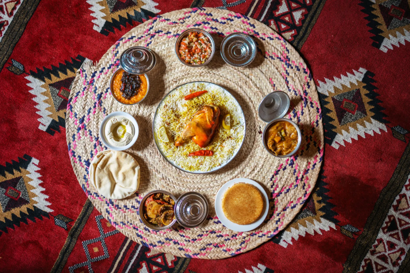 Arabic meal with chicken, rice, sides